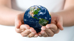 Palm hands Earth globes