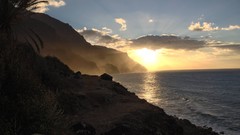 Palm sun Mountains ocean skies seascape