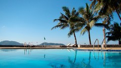 Palm trees swimming pools