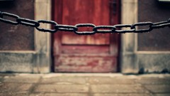 Pavement water drops chains doors blurred background