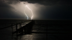 Pier lighting strike dock stormy