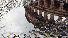 Puddles architecture reflections cobblestones streets