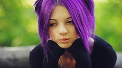 Purple woman models purple hair