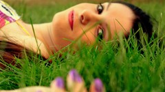 Purple woman nails brown eyes