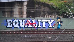 Railroad tracks equality Monopoly graffiti art