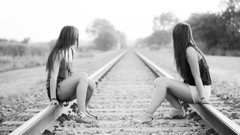 Railroad tracks grayscale girls in nature