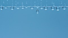 Rain blue background water drops window panes