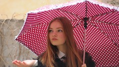 Rain woman Umbrellas redheads polka dots