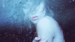 Rain woman water drops closed eyes rain on glass