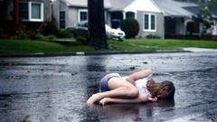 Rain woman wet lonely streets lying down