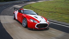 Red track cars turn Aston Martin carousel Zagato vehicles race 