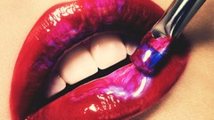 Red woman lips paint brushes