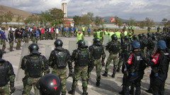 Riot police protest