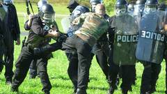 Riots police protest