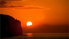 Ripples sunset clouds glow