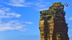 rock Sea water blue brown cliff horizon Men sky clouds sunlight