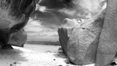 Rocks ocean grayscale photography