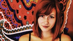 Room carpet woman shoulders smiling brown eyes redheads