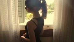 Room woman windows shoulders brunettes ponytails