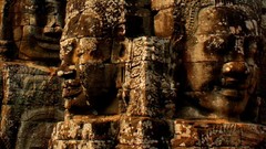 Ruins statues Buddha faces rocks cambodia Angkor Wat