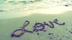 Sand inscription love Beaches waves