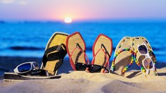Sand ocean bokeh sunglasses slippers depth of field