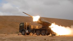 Sand War round Guns dust Army rocket wheels fight shells 