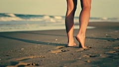 Sand woman legs