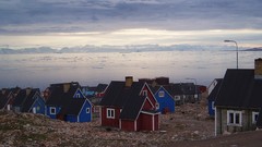 Sea ice architecture houses Greenland skies