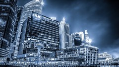 Sea night lights Singapore architecture reflections buildings 