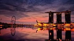 Sea night water clouds lights wheel Singapore architecture 