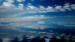 Sea reflections Antarctica bing icebergs skyscapes