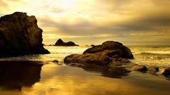 Sea rocks Beaches waves golden skyscapes