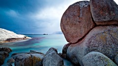 Sea stones blue clouds sky horizon Bank