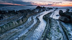 Sea stones nature night water clouds lights rocks