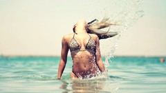 Sea water drops woman blondes models bikini hair toss blowing