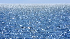 Sea water horizon blue skies