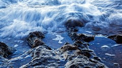 Sea water rocks waves long exposure focused low tide