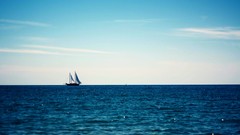 Sea water ships blue skies sailing ships