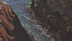 Sea woman rocks legs