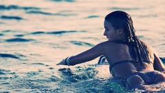 Sea woman surfing swimming bikini