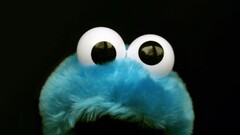 Sesame Street Cookie Monster black background eyes
