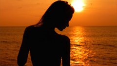 Silhouettes woman sunset