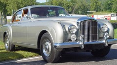 Silver Bentley flying