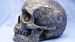 Silver side view skulls Celtic