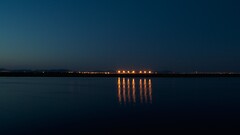 sky lights water reflection dark outdoors