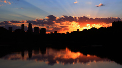 skyline sunlight clouds water dusk cityscape