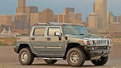 Skyscrapers Hummer trucks vehicles cityscapes