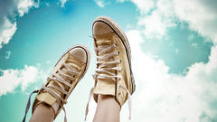 Sneakers legs up clouds