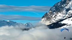 Snow Mountains clouds parachute parachuting